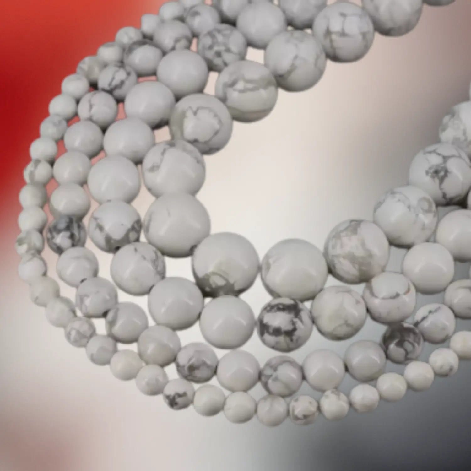 Perles de howlite blanche naturelle aux veines grises, utilisées pour des bijoux en macramé artisanaux Fil Dé Toile